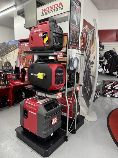 Display of Honda EU2200i, EU3200i, and EU7000iS portable generators inside Hamburg Honda showroom.